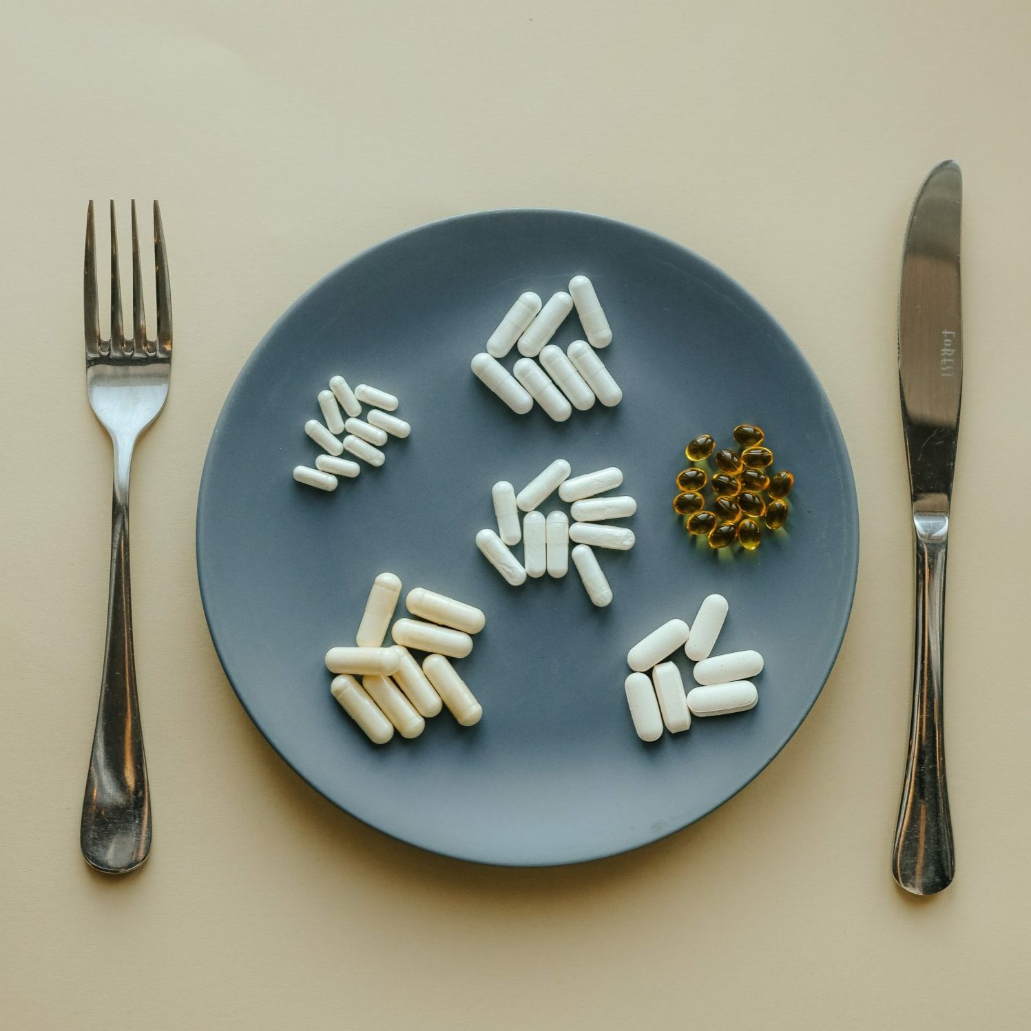 Pic of a plate with supplement pills display in it.