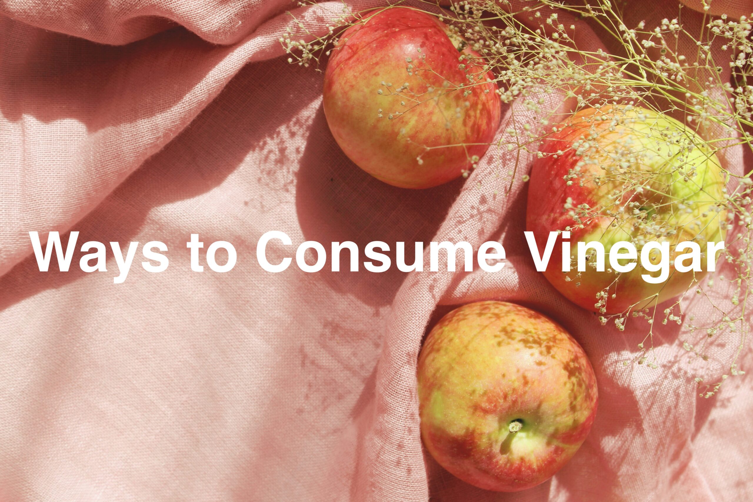 pic of apples on a pink tea towel with the title above: Way to consume Vinegar